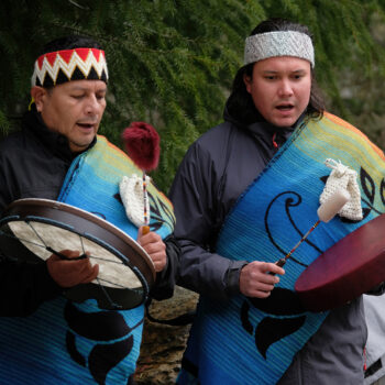 Squamish Canoe Family performing as part of the Log Blessing for the SLCC Community Reconciliation Canoe: From left: Ray Natraoro, Jonas Jones