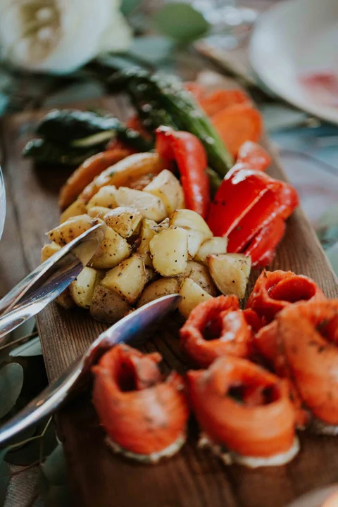 Platter of smoked salmon rolls with roasted potatoes and bell peppers for a wedding meal in Whistler.