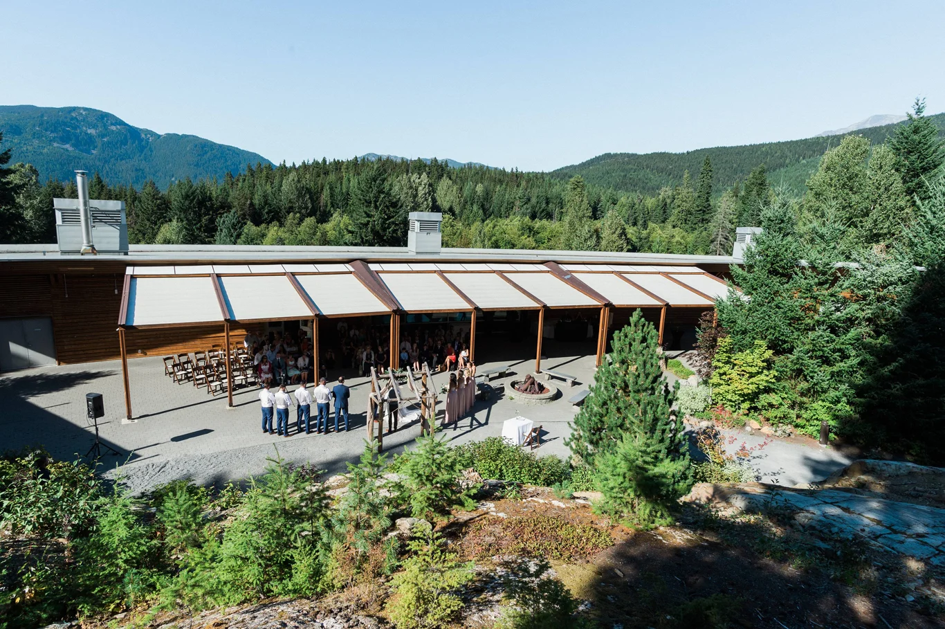 Wedding ceremony setup at SLCC with forest backdrop