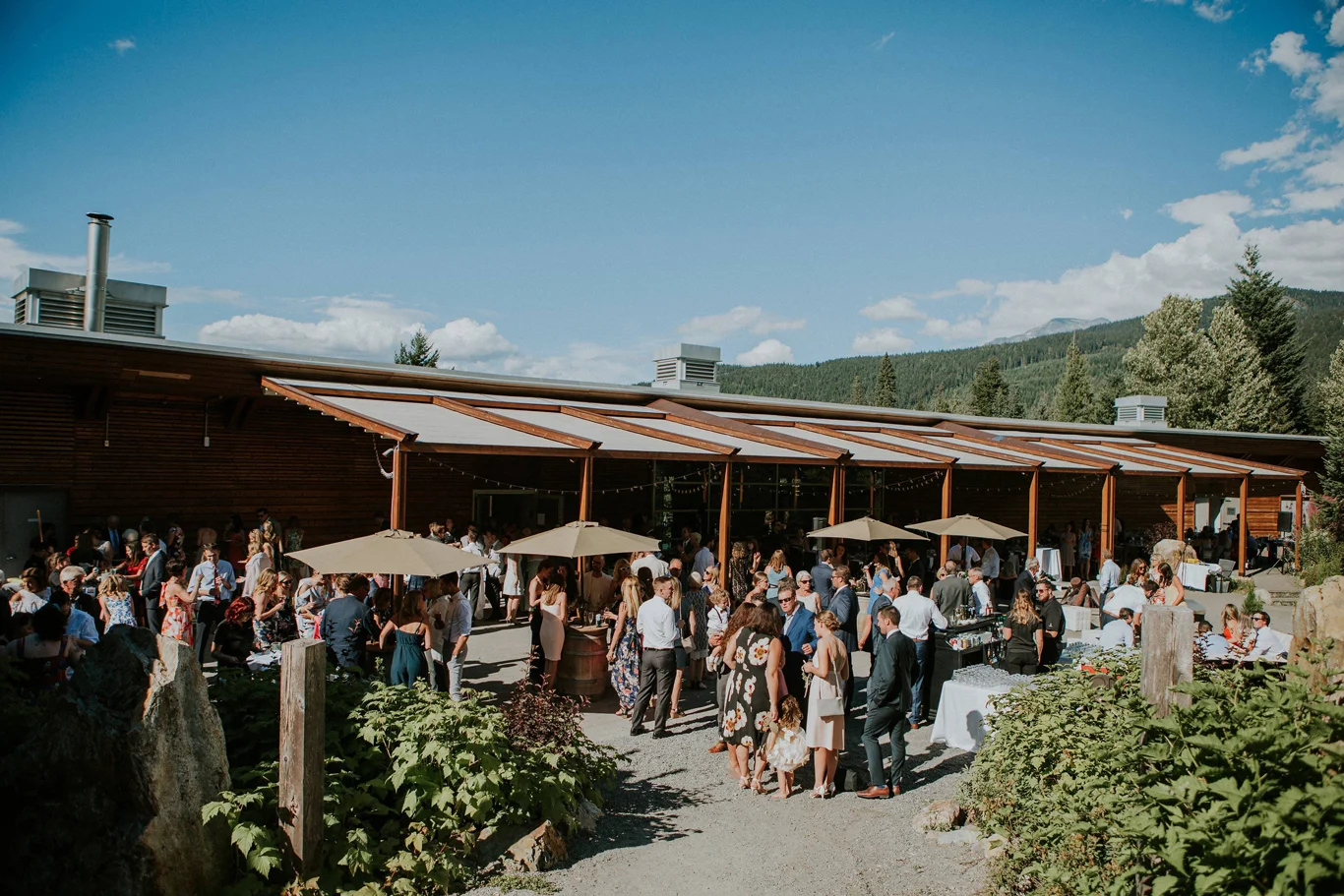 Summer event at SLCC with guests gathered on the patio